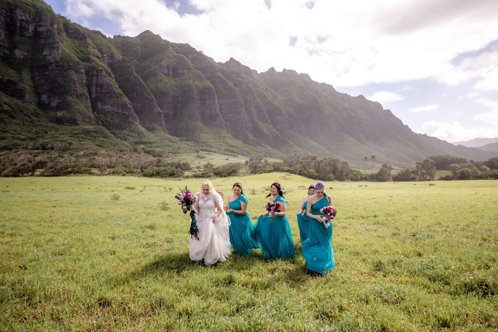 bridesmaid with bride at Kualoa Ranch Wedding with Iwalani Photography