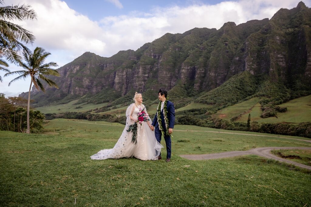 bride and groom take portraits at Kualoa Ranch Wedding with Iwalani Photography