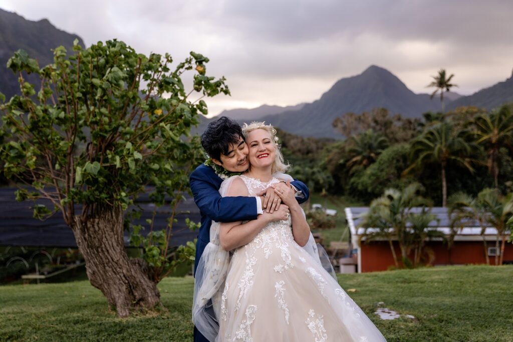 bride and groom take portraits at Kualoa Ranch Wedding with Iwalani Photography