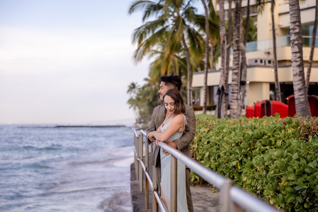 couple taking engagement photos in Waikiki
