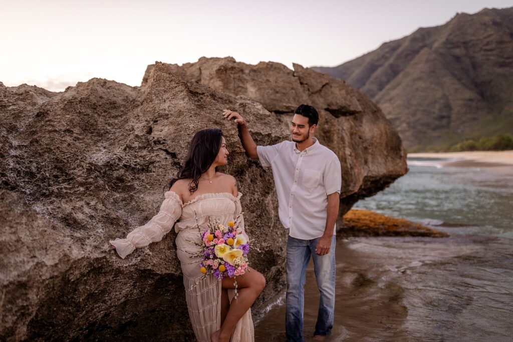 couple on beach taking photos