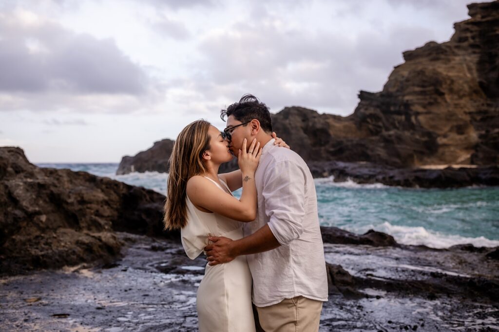couple taking engagement photos with Iwalani Photography