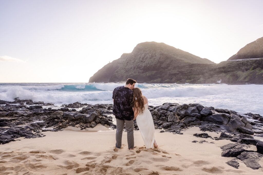 couple taking engagement photos on Oahu, Hawaii with Iwalani Photography