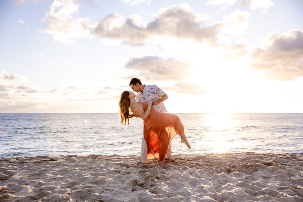couple taking engagement photos on Oahu, Hawaii with Iwalani Photography