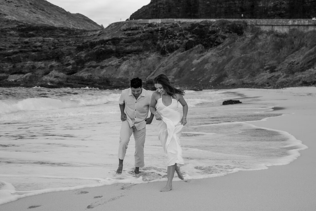 couple taking engagement photos on Oahu, Hawaii with Iwalani Photography