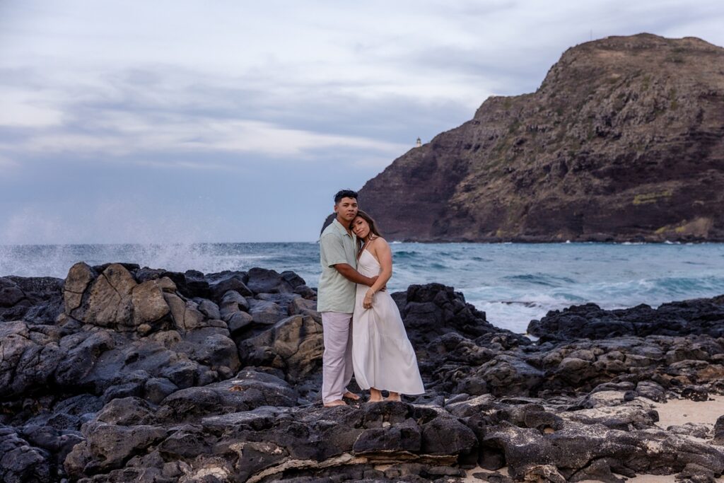 couple taking engagement photos on Oahu, Hawaii with Iwalani Photography